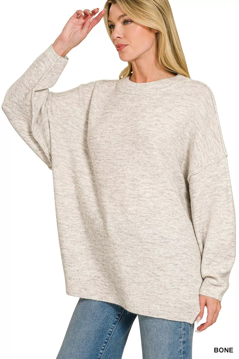 Light gray Zenana oversized round neck sweater with exposed seams and melange pattern, casual and cozy fashion piece.