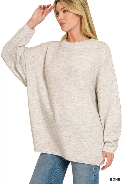 Light gray Zenana oversized round neck sweater with exposed seams and melange pattern, casual and cozy fashion piece.