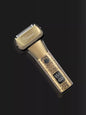 Trendsi LED display hair clipper with brass body and adjustable blades, showing digital battery indicator and sleek design.