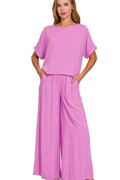 Bright mauve Zenana round neck T-shirt and wide-leg pants set by Trendsi, displayed flat on a white background.