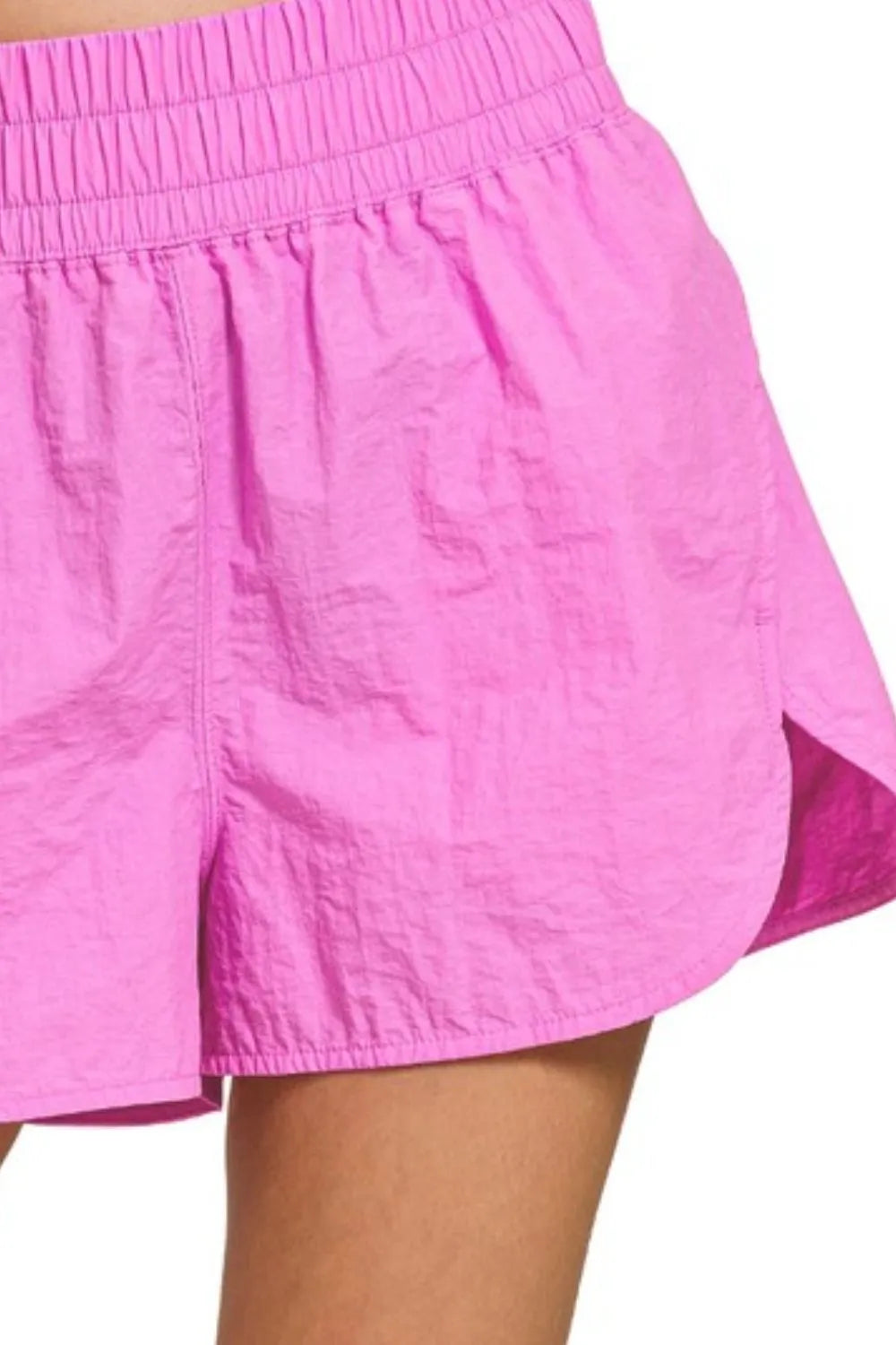 Bright mauve Zenana windbreaker running shorts with smocked waistband, designed for comfortable activewear.