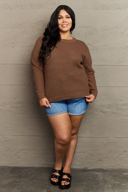 Plus size Zenana Breezy Days high-low waffle knit sweater in brown, featuring a cozy, textured fabric and relaxed fit.