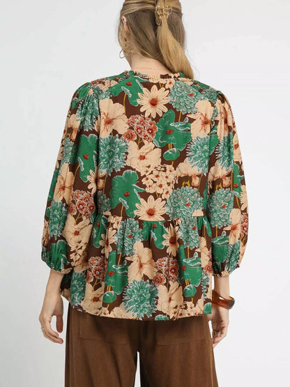 Brown floral peplum blouse with tie neck from Umgee, featuring a mixed floral pattern and stylish design.