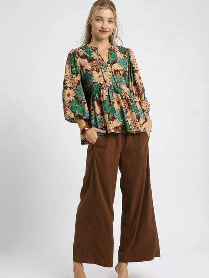 Brown floral peplum blouse with tie neck by Umgee, featuring mixed floral pattern and stylish design.