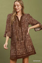 Umgee brown geometric print V-neck tunic dress with tassel detail, casual style, short sleeves, and relaxed fit.