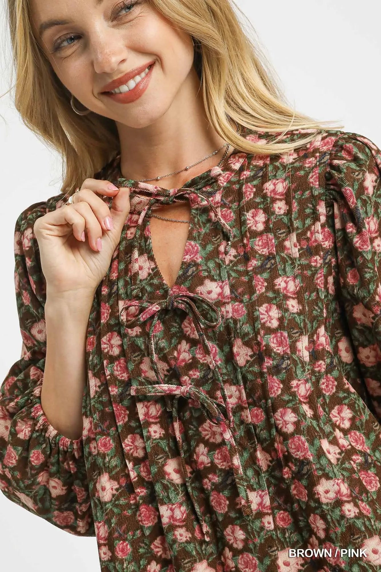 Brown and pink floral Umgee babydoll dress with tie-neck detail, featuring a flowy silhouette and feminine style.
