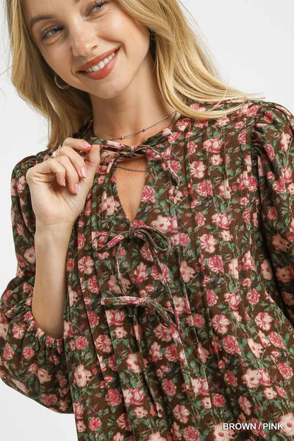 Brown and pink floral Umgee babydoll dress with tie-neck detail, featuring a flowy silhouette and feminine style.