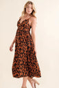 Leopard print plunge maxi dress from Trendsi featuring a fitted bodice and flowing skirt, perfect for stylish evening wear.