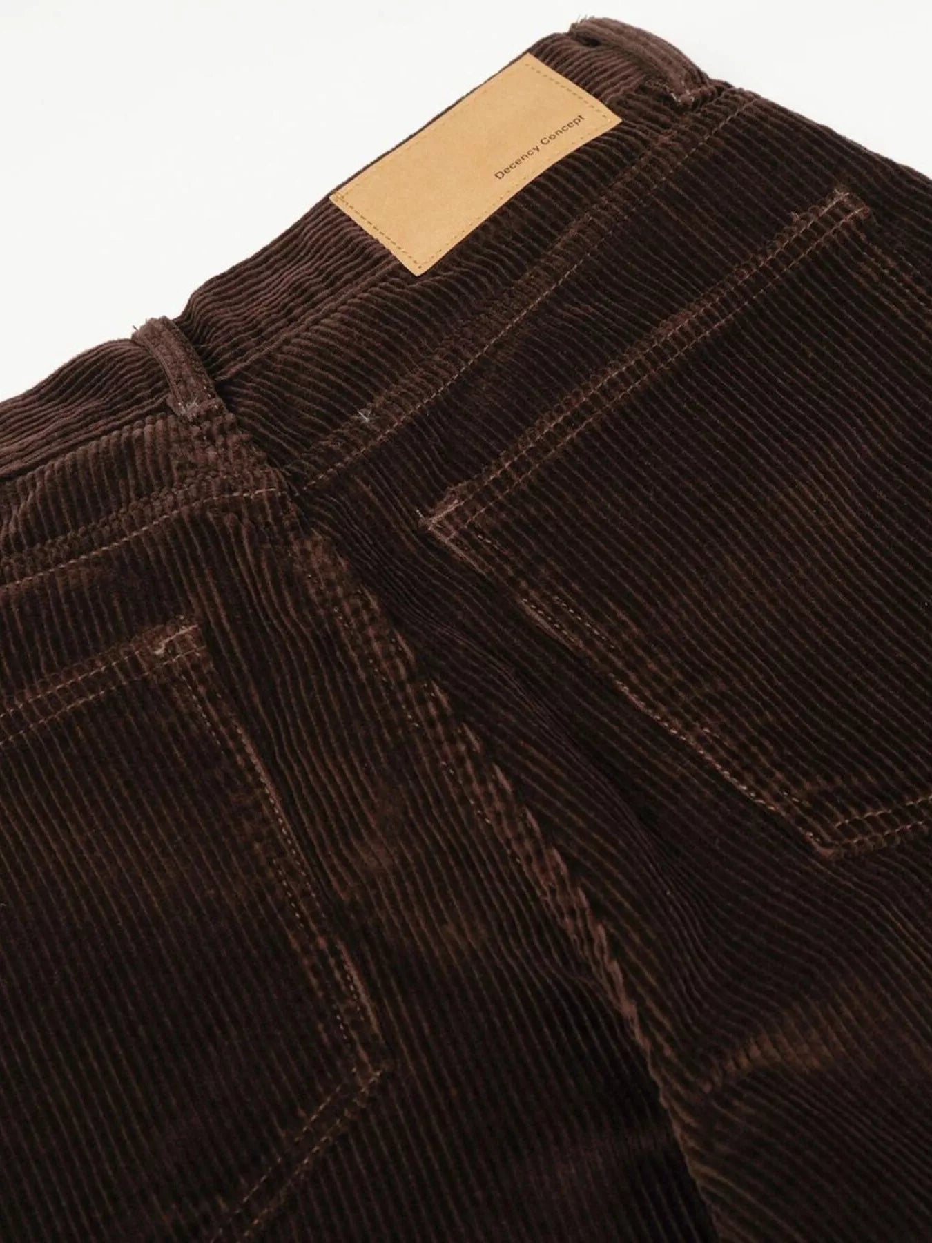 Men's wide leg corduroy pants in brown from Trendsi, featuring a relaxed fit and textured fabric for casual style.