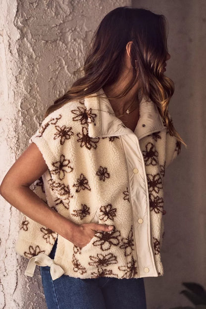 Brown SO ME Flower Sherpa Fur oversized sleeveless vest jacket with plush Sherpa lining and floral pattern detail.