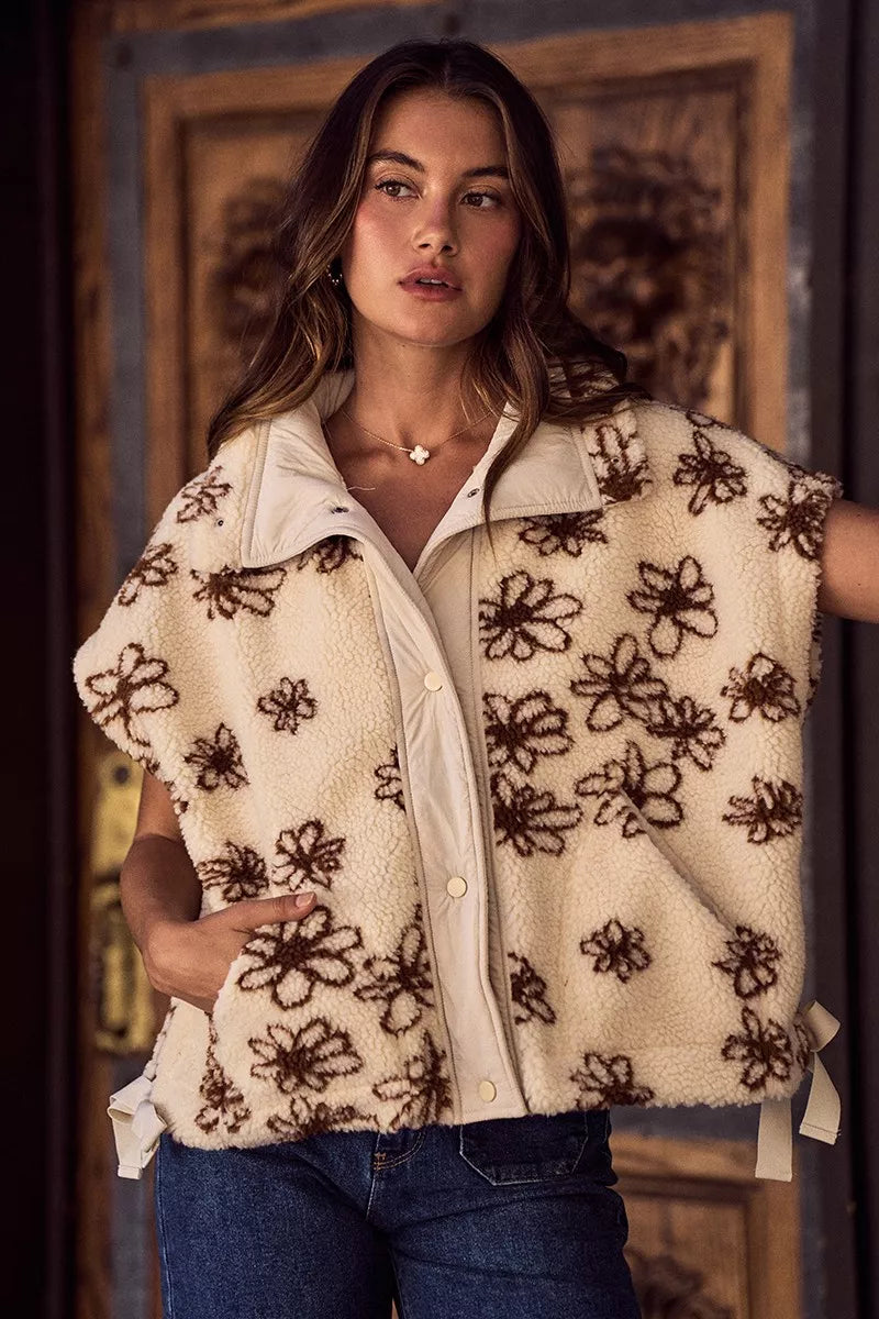 Brown SO ME Flower Sherpa Fur oversized sleeveless vest jacket by Trendsi with plush Sherpa fur and floral design details.