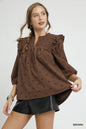 Brown Umgee bow print corduroy puff sleeve blouse with ruffled details, styled with a classic and feminine silhouette.