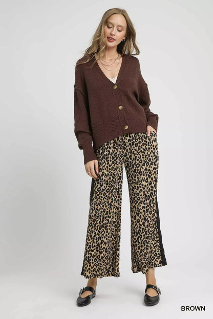 Brown Umgee button-front V-neck knit cardigan with long sleeves, featuring a cozy, stylish design and front button closures.
