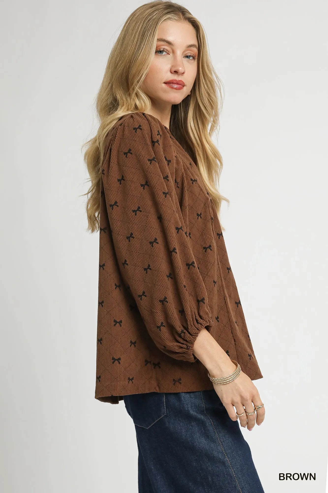 Brown Umgee corduroy balloon sleeve blouse with bow print and stylish details, perfect for casual or chic outfits.