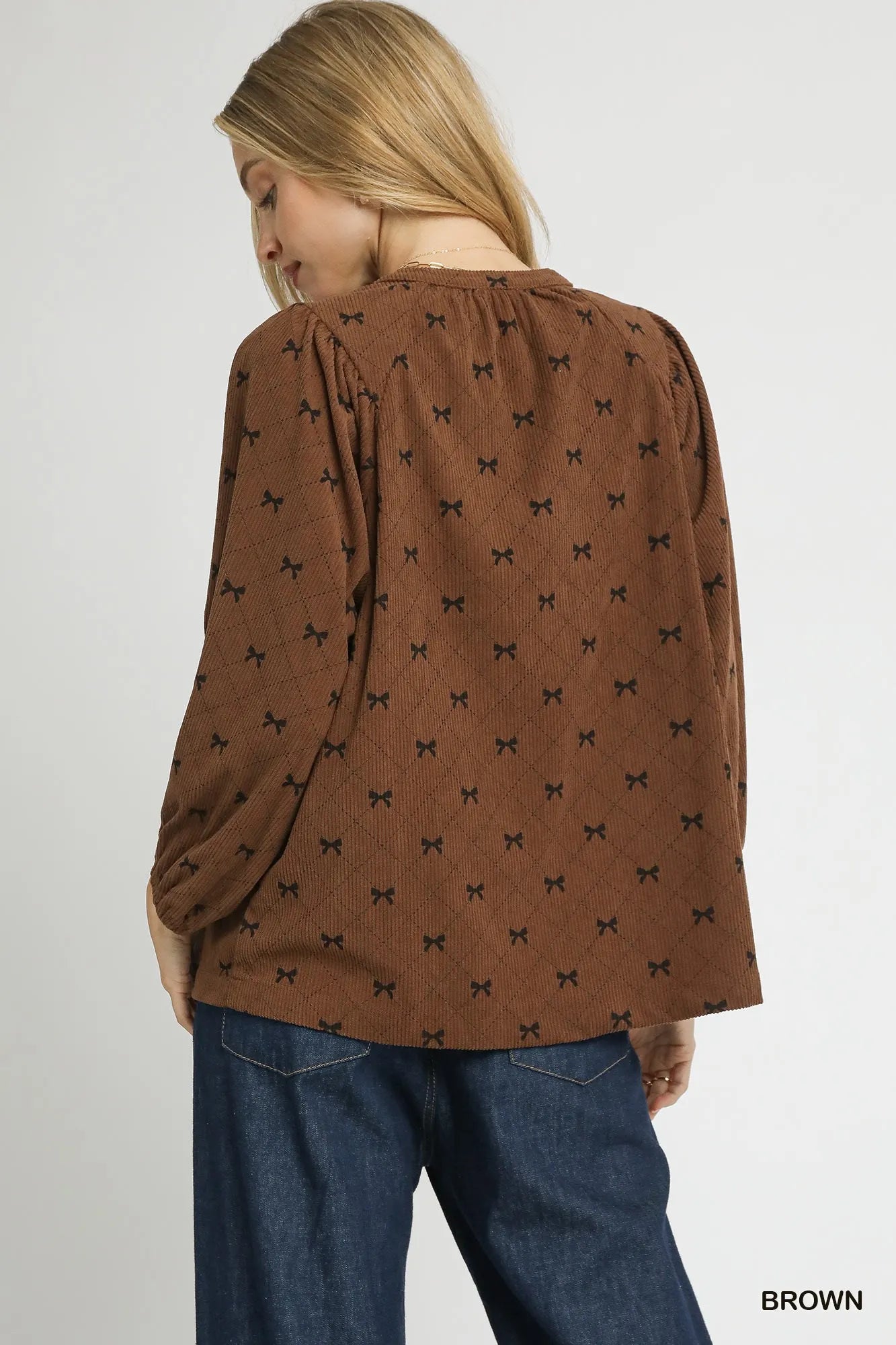 Brown corduroy balloon sleeve blouse with bow print from Umgee, featuring a stylish and comfortable design.