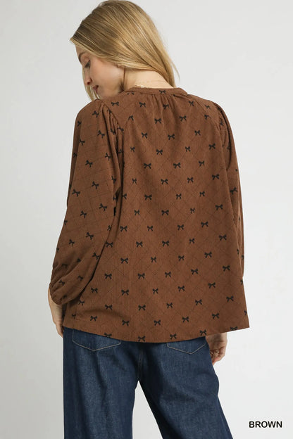 Brown corduroy balloon sleeve blouse with bow print from Umgee, featuring a stylish and comfortable design.