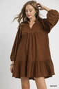 Brown Umgee corduroy tiered babydoll dress with long sleeves and a relaxed fit, styled for casual wear.