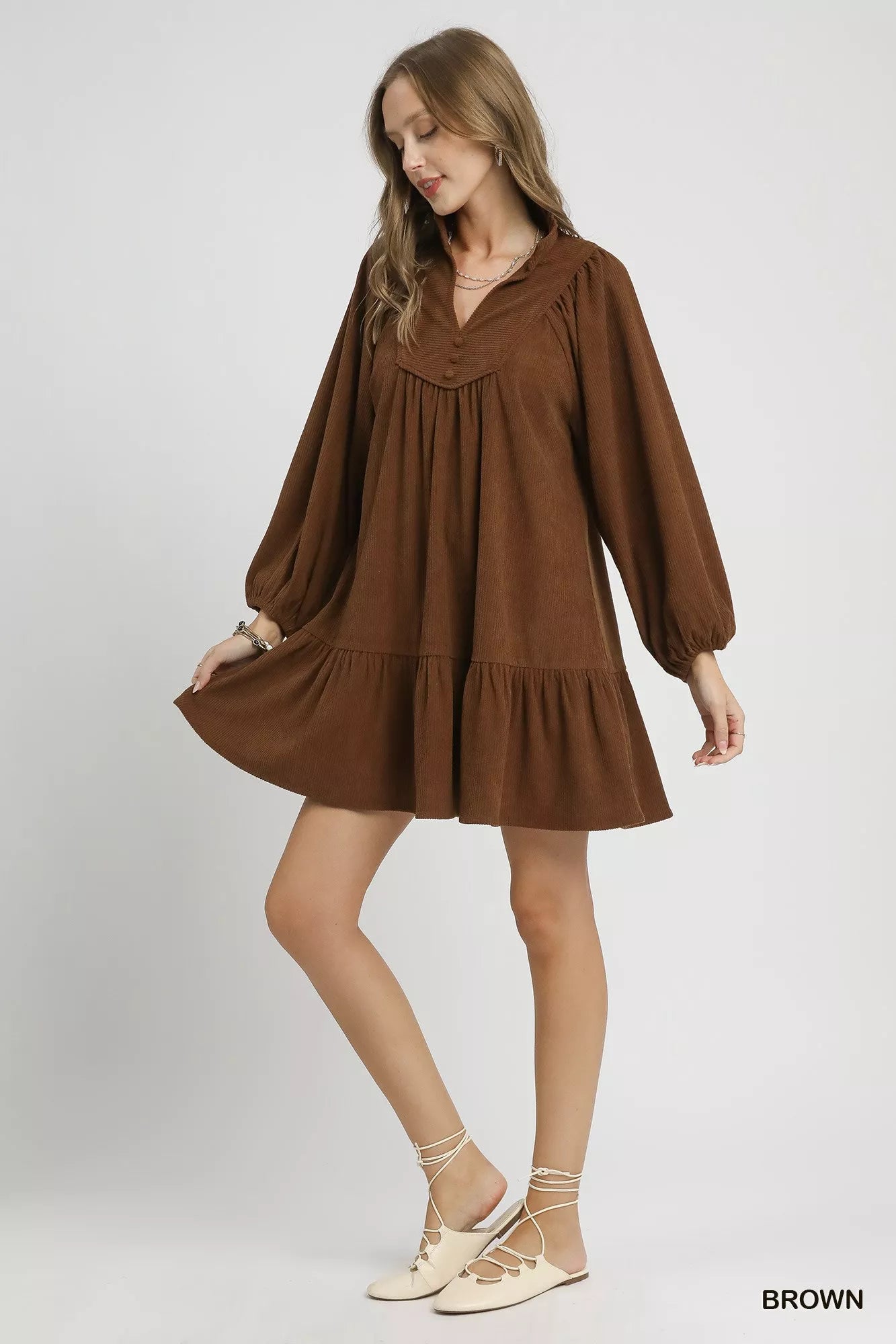 Brown Umgee corduroy tiered babydoll dress with long sleeves and a relaxed fit, perfect for casual and chic occasions.
