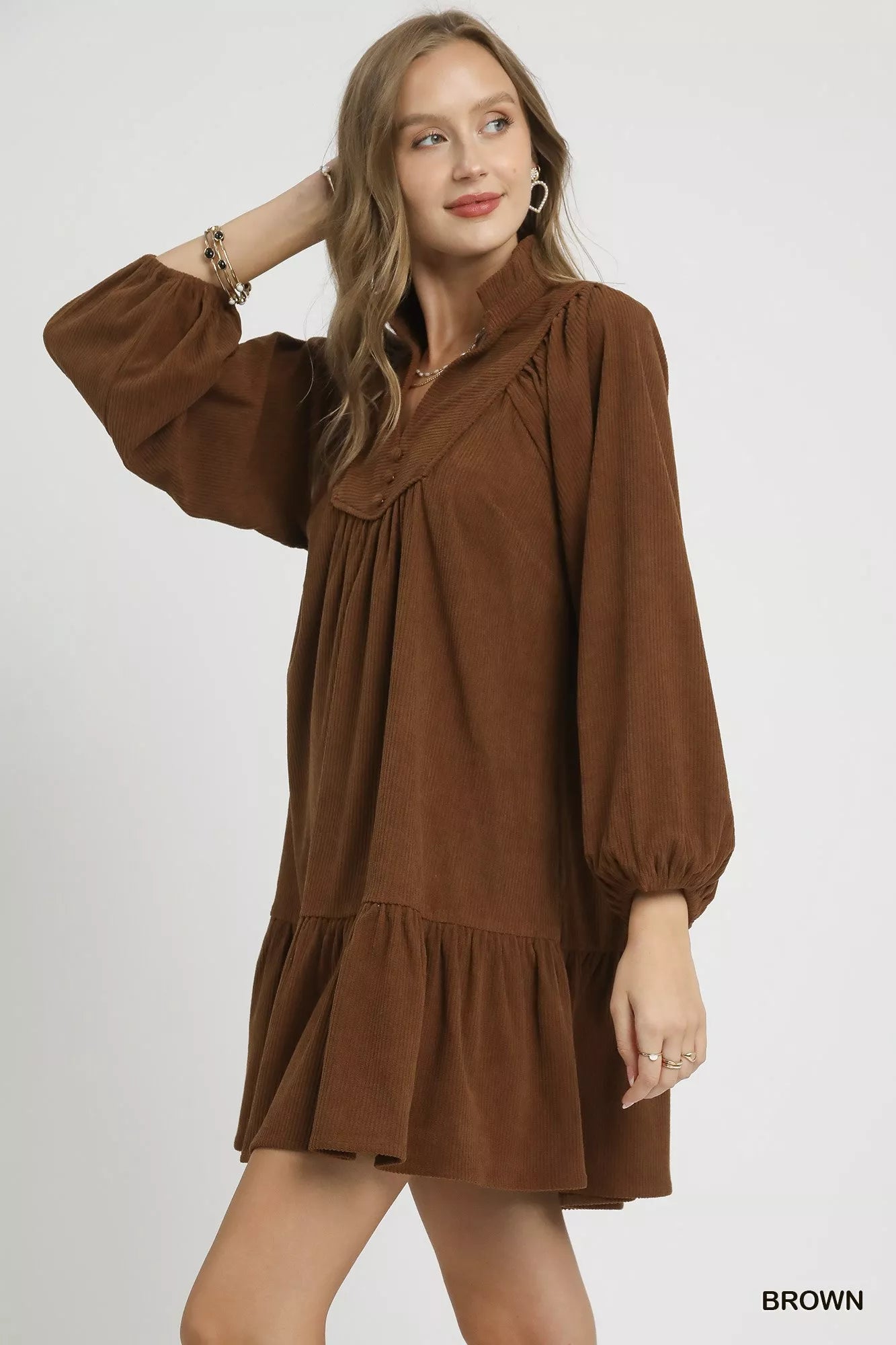 Brown Umgee corduroy tiered babydoll dress with long sleeves, featuring a relaxed fit and tiered skirt for a casual, vintage-inspired look.