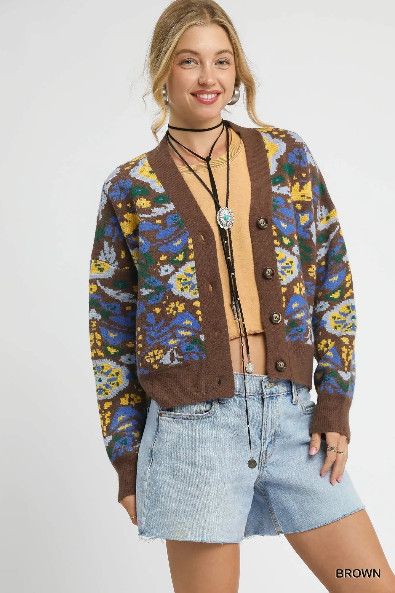 Brown Umgee floral knit button-up cardigan featuring a cozy knit texture and front button closure, styled with a relaxed fit.