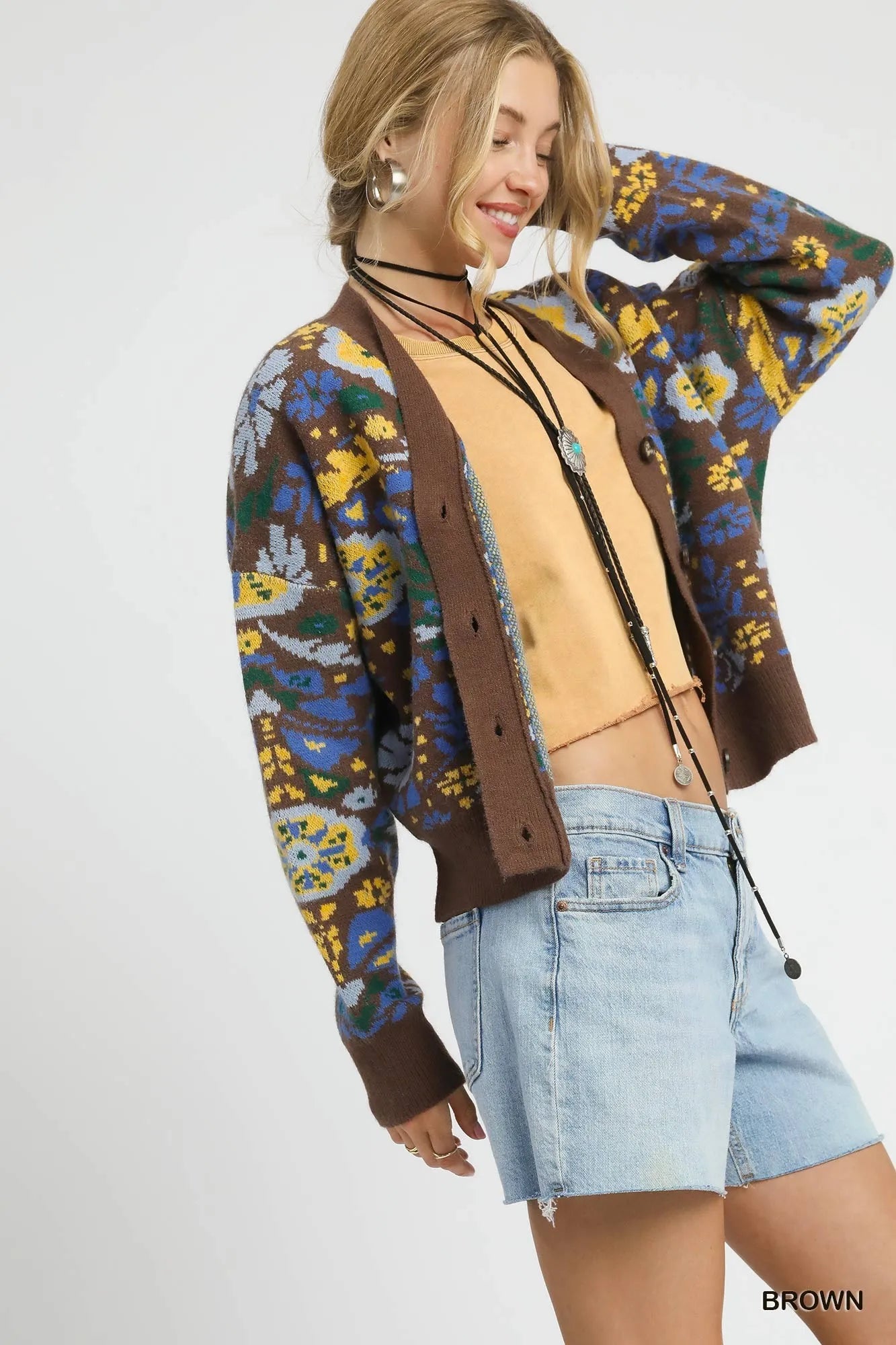 Brown floral knit button-up cardigan by Umgee featuring a cozy, patterned design and front buttons.