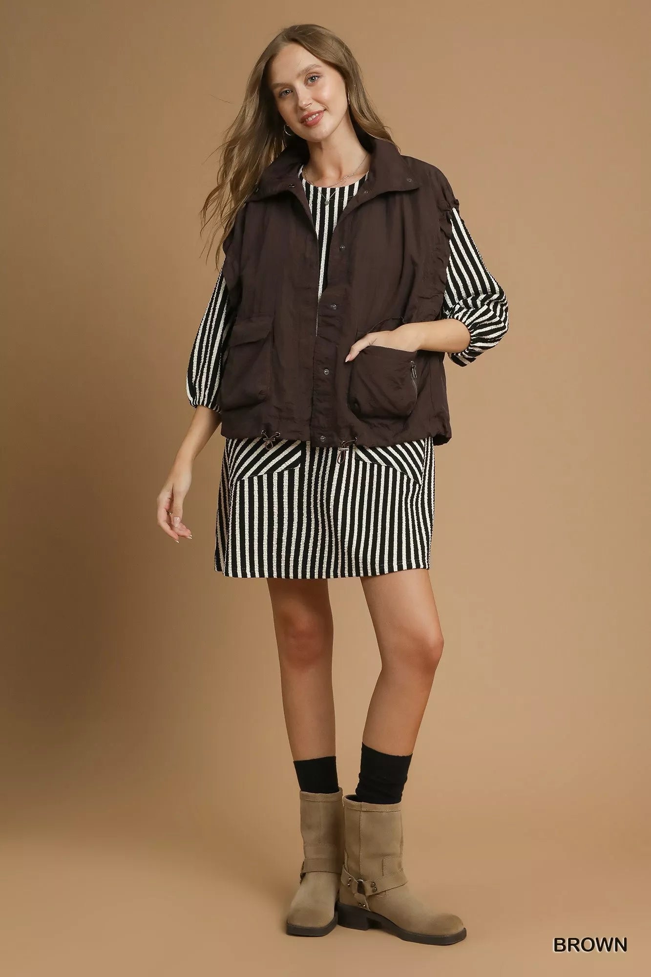 Brown Umgee nylon vest with pockets, featuring a lightweight design and casual style, perfect for layering.