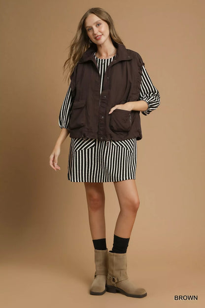 Brown Umgee nylon vest with pockets, featuring a lightweight design and casual style, perfect for layering.
