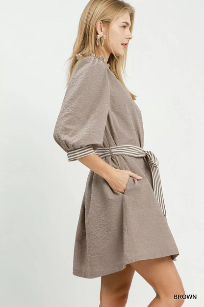 Brown Umgee textured mini dress with contrast trim and tie waist, stylish and casual for everyday wear
