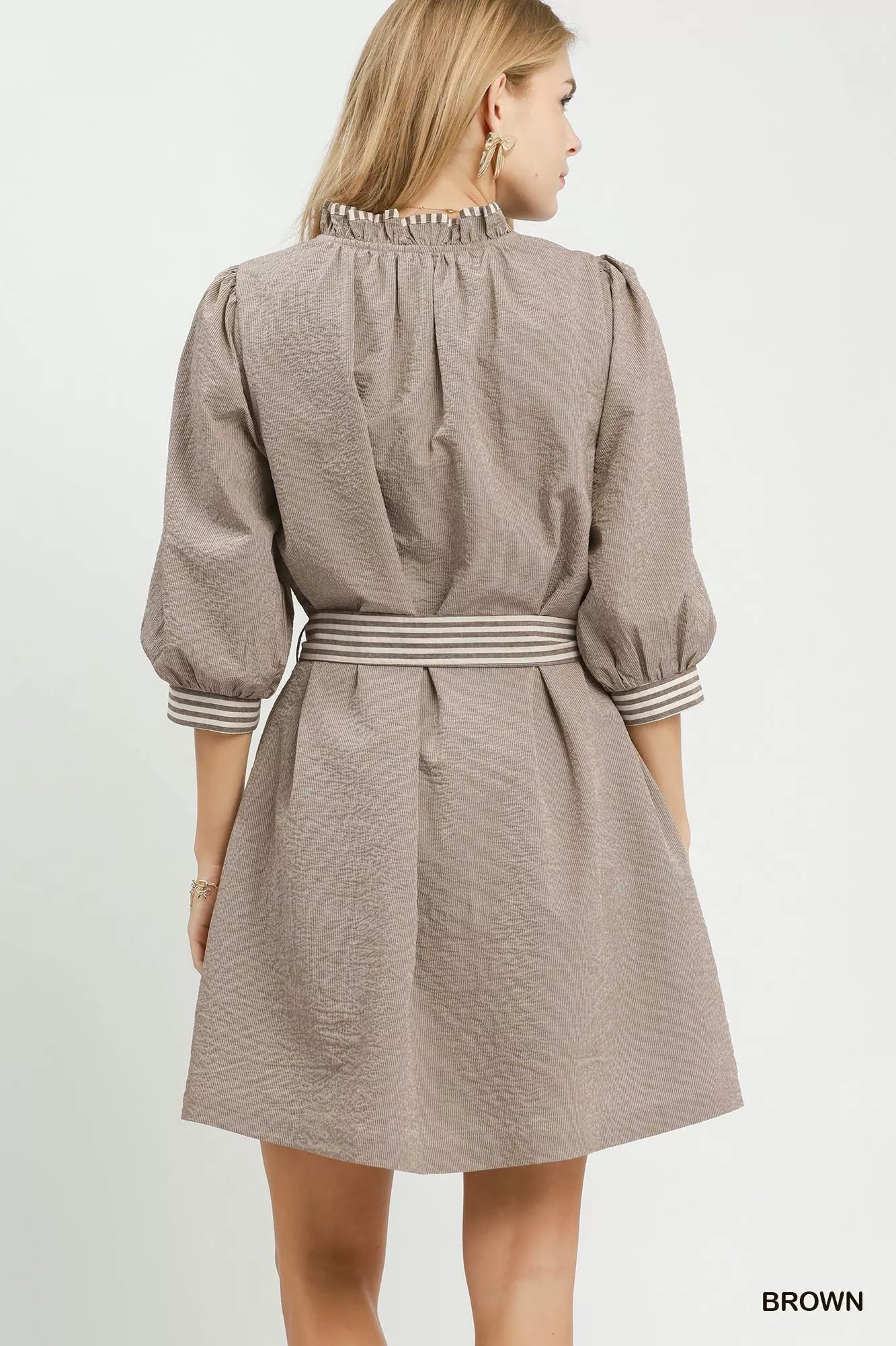 Brown Umgee textured mini dress with contrast trim, tie waist, perfect for casual or stylish summer looks.