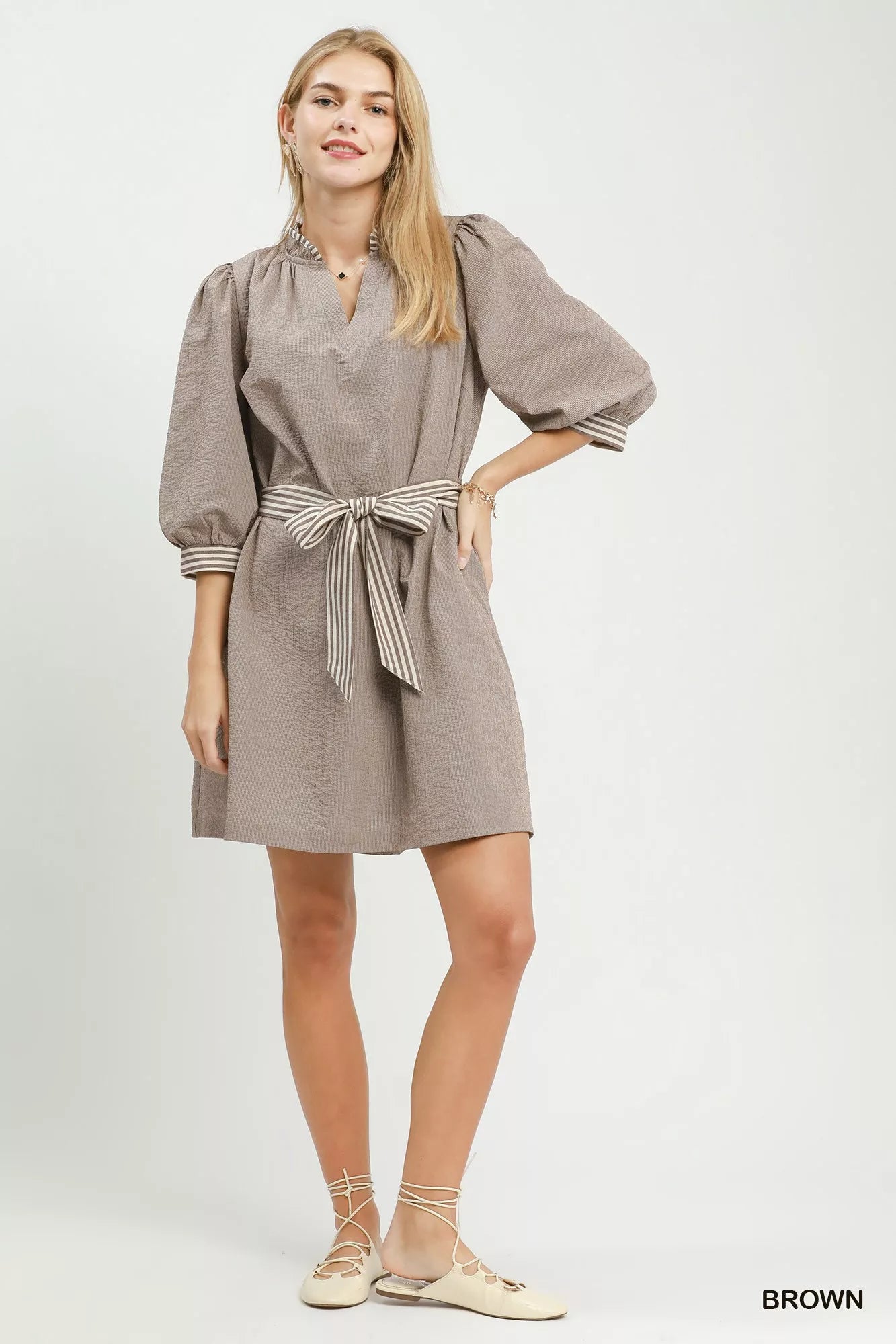 Brown Umgee textured tie waist mini dress with contrast trim, featuring a stylish silhouette and casual chic design.