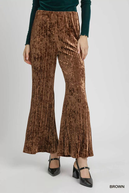 Brown Umgee velvet pleated wide-leg pants with a relaxed fit and high-waist design, showcased on a model.