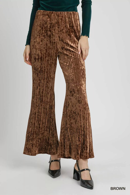 Brown Umgee velvet pleated wide-leg pants with a relaxed fit and high-waist design, showcased on a model.