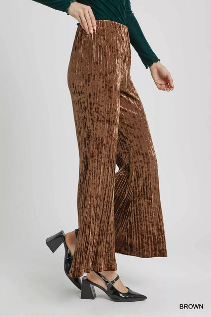Brown Umgee velvet pleated wide-leg pants with a relaxed fit, featuring a high waist and flowing design.