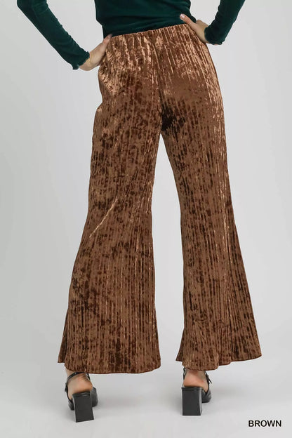 Brown Umgee velvet pleated wide-leg pants with a relaxed fit, featuring a high waist and flowing silhouette.