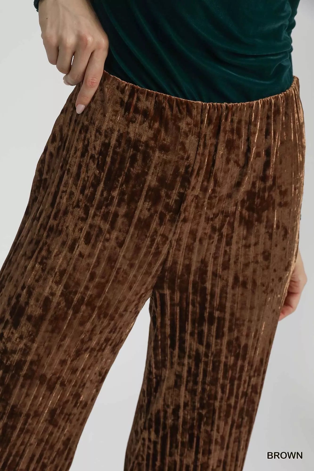 Brown Umgee velvet pleated wide-leg pants with a relaxed fit, featuring a high waist and flowing silhouette.