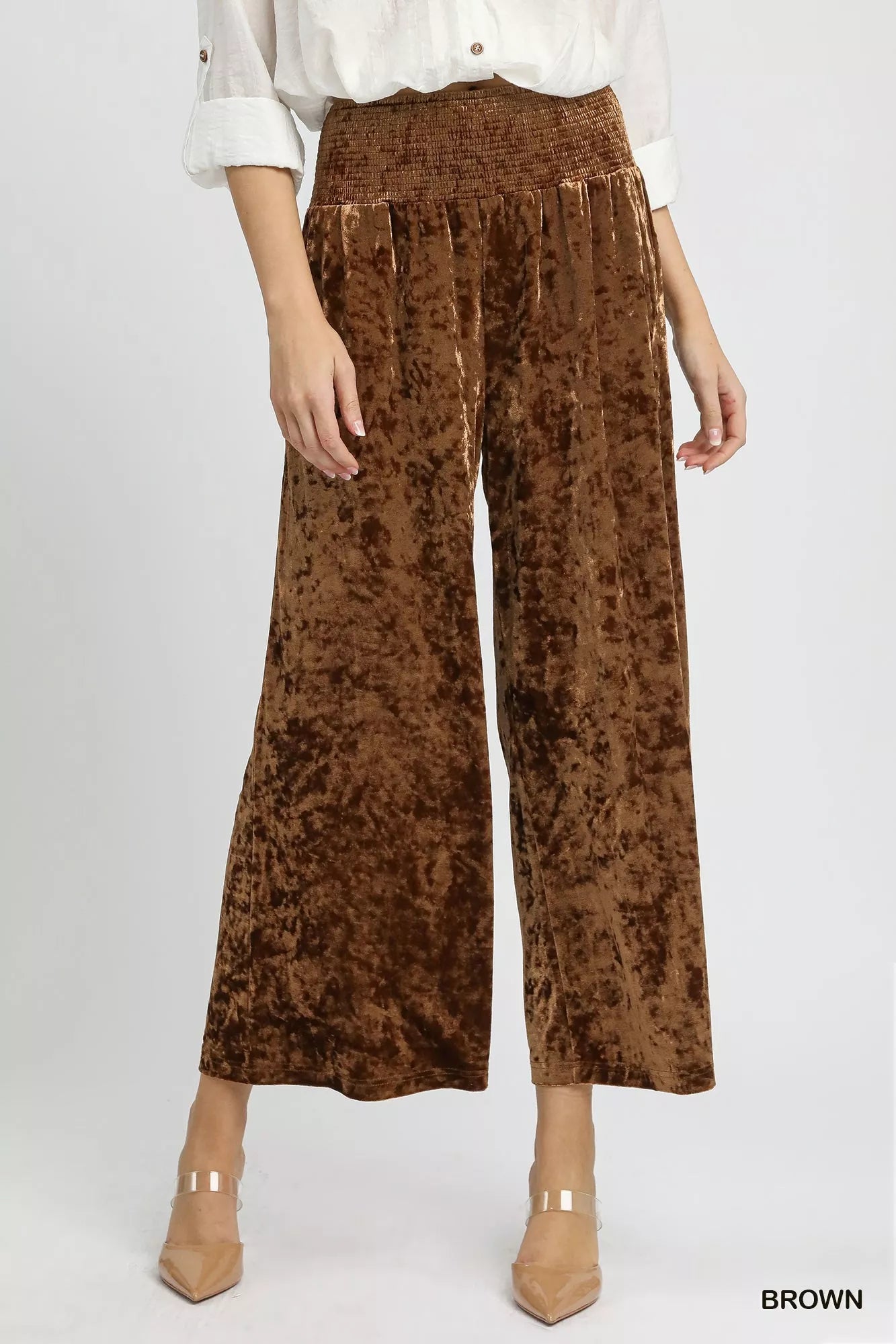 Brown Umgee velvet wide-leg pants with smocked waistband, featuring a relaxed fit and stylish design.