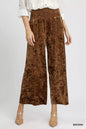 Brown Umgee velvet wide-leg pants with smocked waistband, featuring a relaxed fit and stylish design.