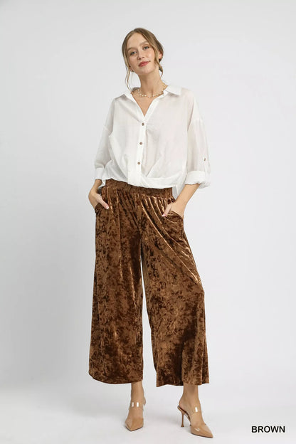 Brown Umgee velvet wide-leg pants with smocked waistband, styled with a relaxed fit and soft fabric.
