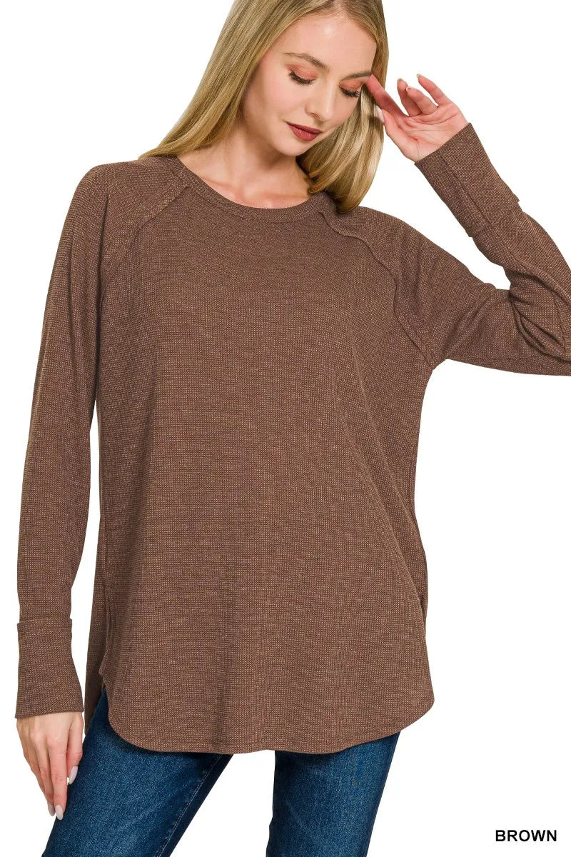 Brown Zenana Baby Waffle Long Sleeve Top from Trendsi, soft fabric with a waffle texture, featuring long sleeves and a cozy fit.