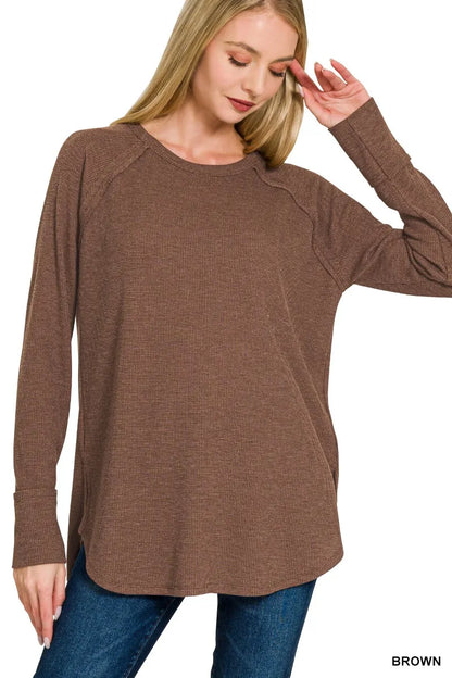 Brown Zenana Baby Waffle Long Sleeve Top from Trendsi, soft fabric with a waffle texture, featuring long sleeves and a cozy fit.