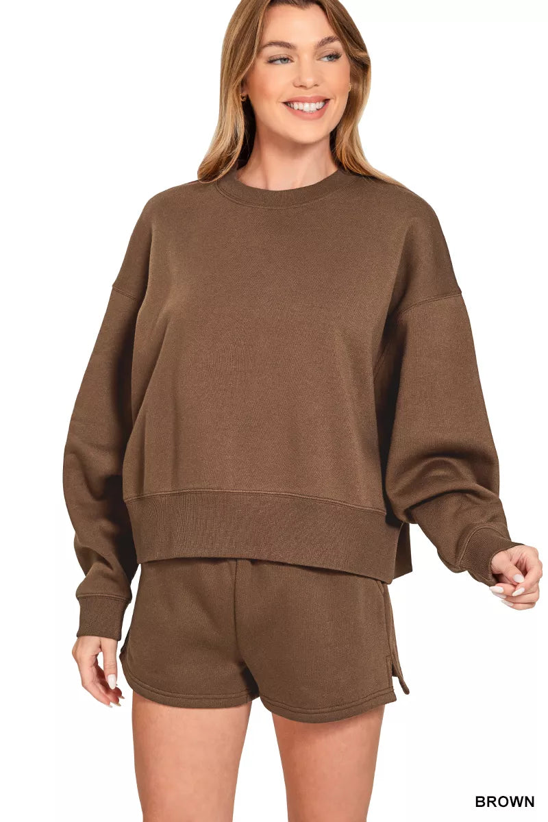 Brown Zenana fleece sweatshirt and shorts set with round neck, casual loungewear by Trendsi, shown on a model.
