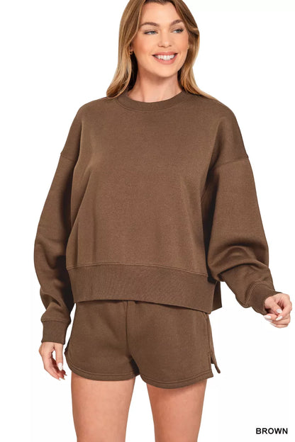 Brown Zenana fleece sweatshirt and shorts set with round neck, casual loungewear by Trendsi, shown on a model.