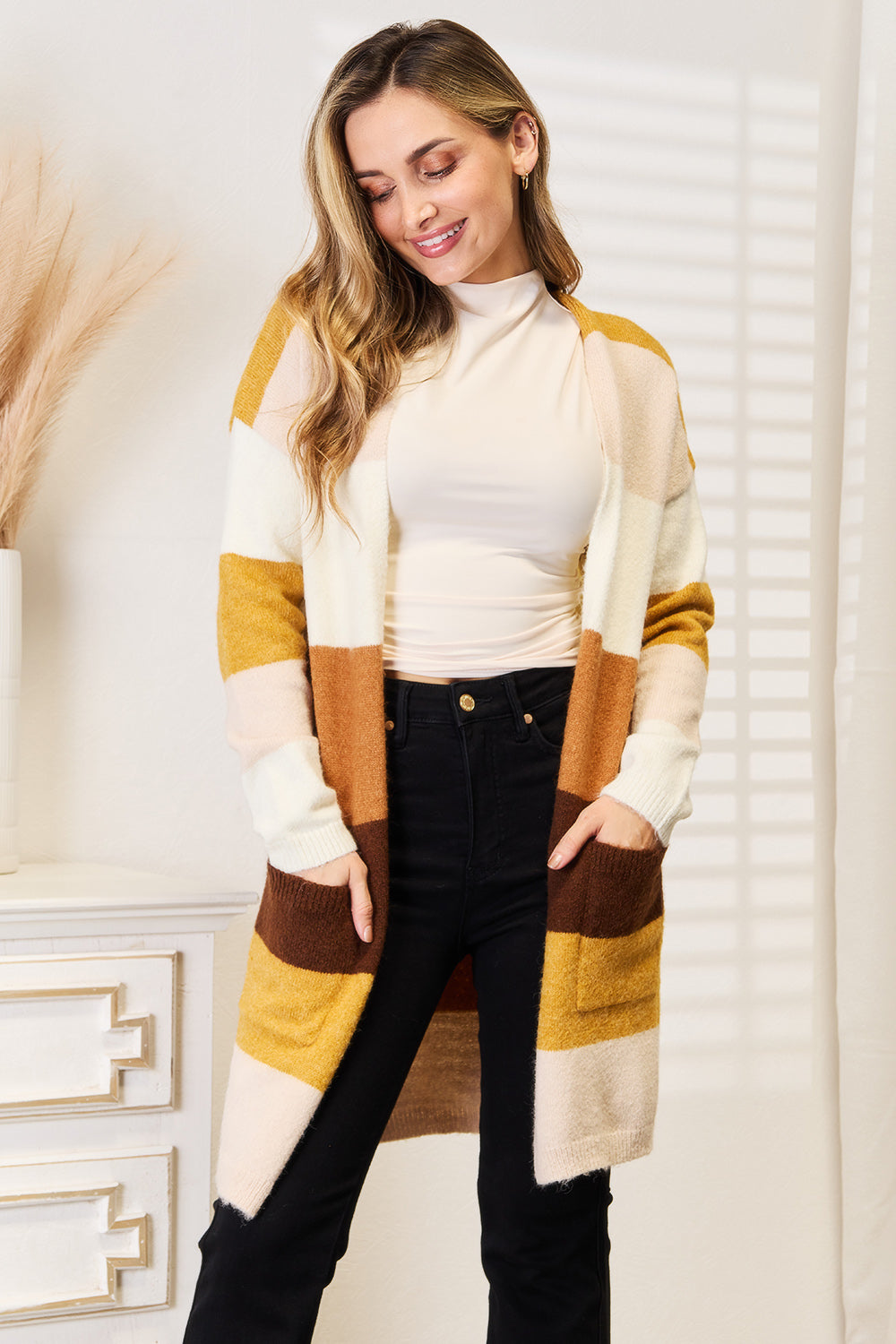 Woven brown and tan color block dropped shoulder cardigan with a relaxed fit, featuring a stylish right side design by Trendsi.
