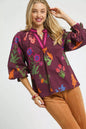 Burgundy floral print Umgee blouse with flounce sleeves, featuring a relaxed fit and feminine design.