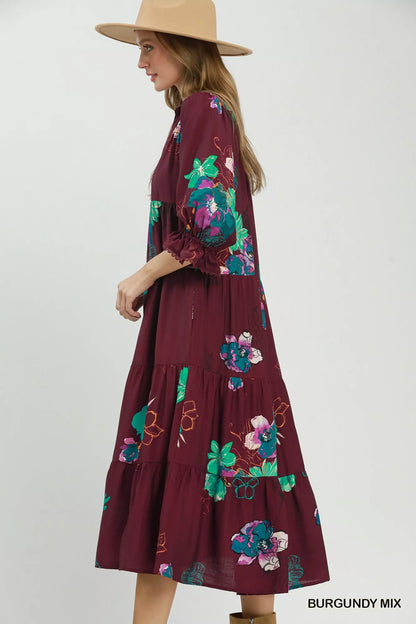 Trendsi Umgee floral print tiered midi dress with puff sleeves in burgundy and mixed colors, flowing and stylish for spring.