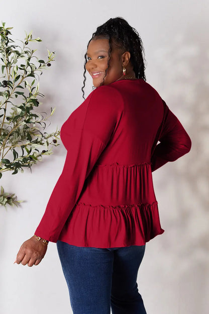 Burgundy Trendsi double take half-button long sleeve blouse with ruffle hem, stylish and feminine for versatile wear
