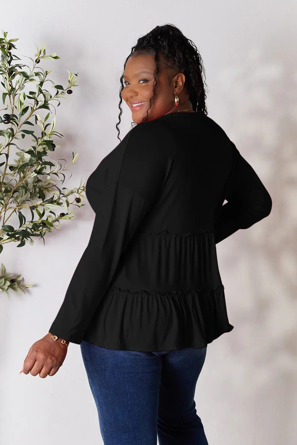 Burgundy long sleeve blouse by Trendsi with half-button front, ruffle hem, and semi-fitted style.
