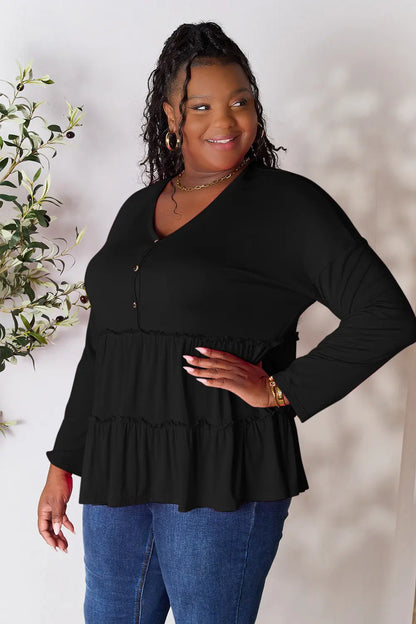 Burgundy Trendsi Double Take blouse with half-button closure, long sleeves, and ruffle hem, stylish and feminine for versatile wear.