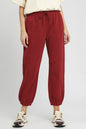 Burgundy Umgee fleece jogger pants with drawstring waist, slim fit, and cozy soft fabric, shown on a mannequin.