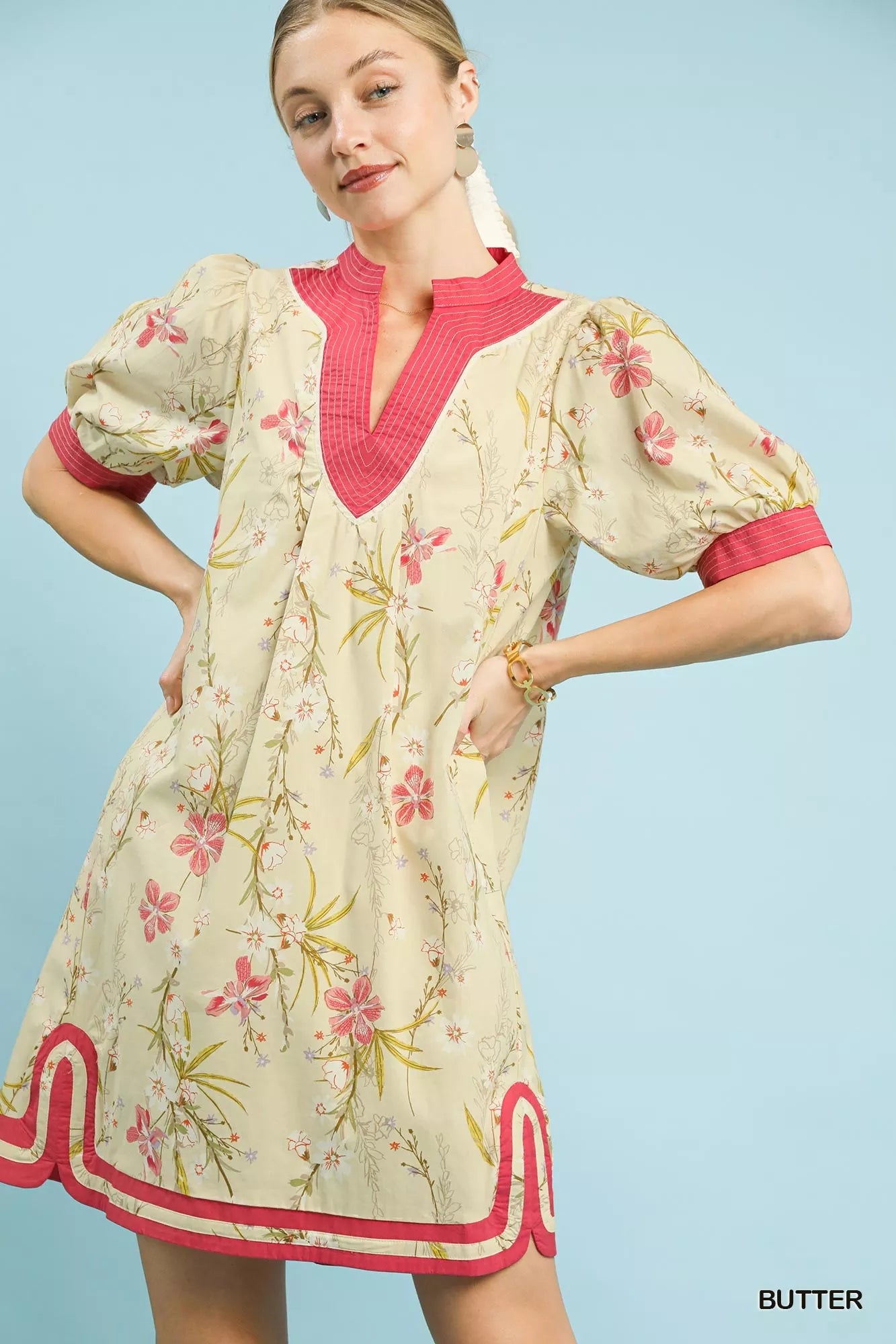 Umgee floral puff sleeve dress with contrast trim, featuring a feminine silhouette and vibrant floral pattern.